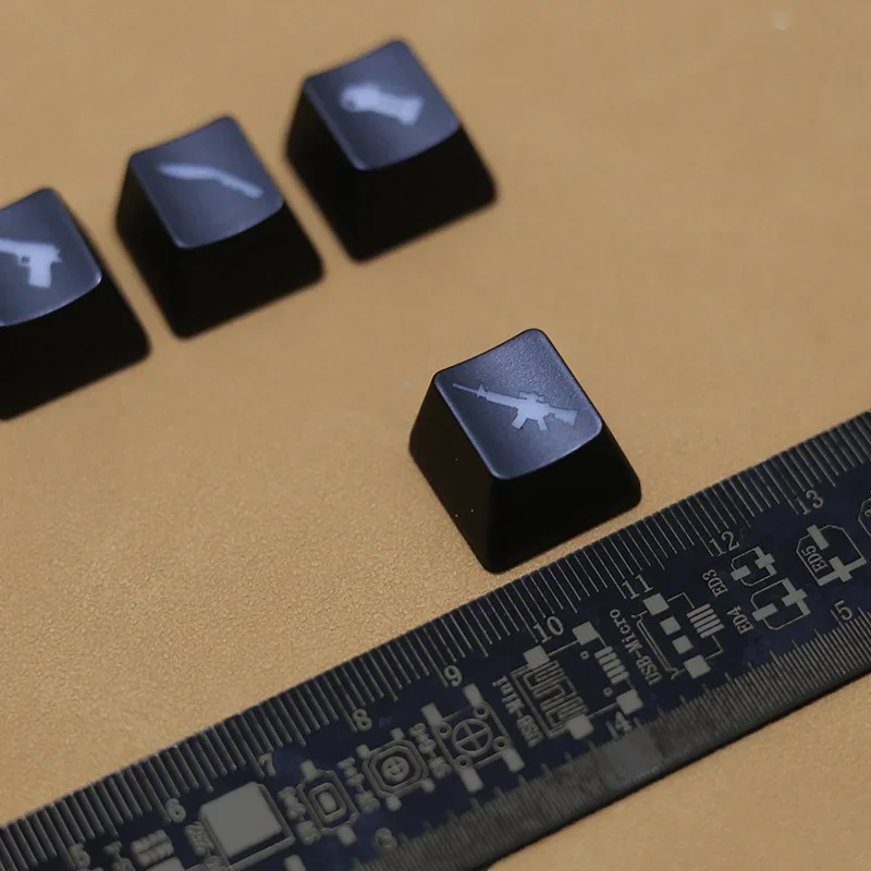 Close-up of a translucent red CSGO weapon keycap, showcasing its iconic silhouette and vibrant illuminated detail for a tactical gaming setup.