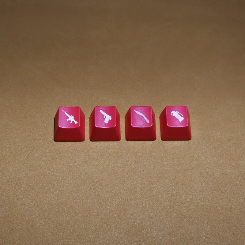 Vibrant, translucent CSGO weapon keycaps, featuring iconic red-lit weapon silhouettes from an overhead view, enhancing any gamer's setup.