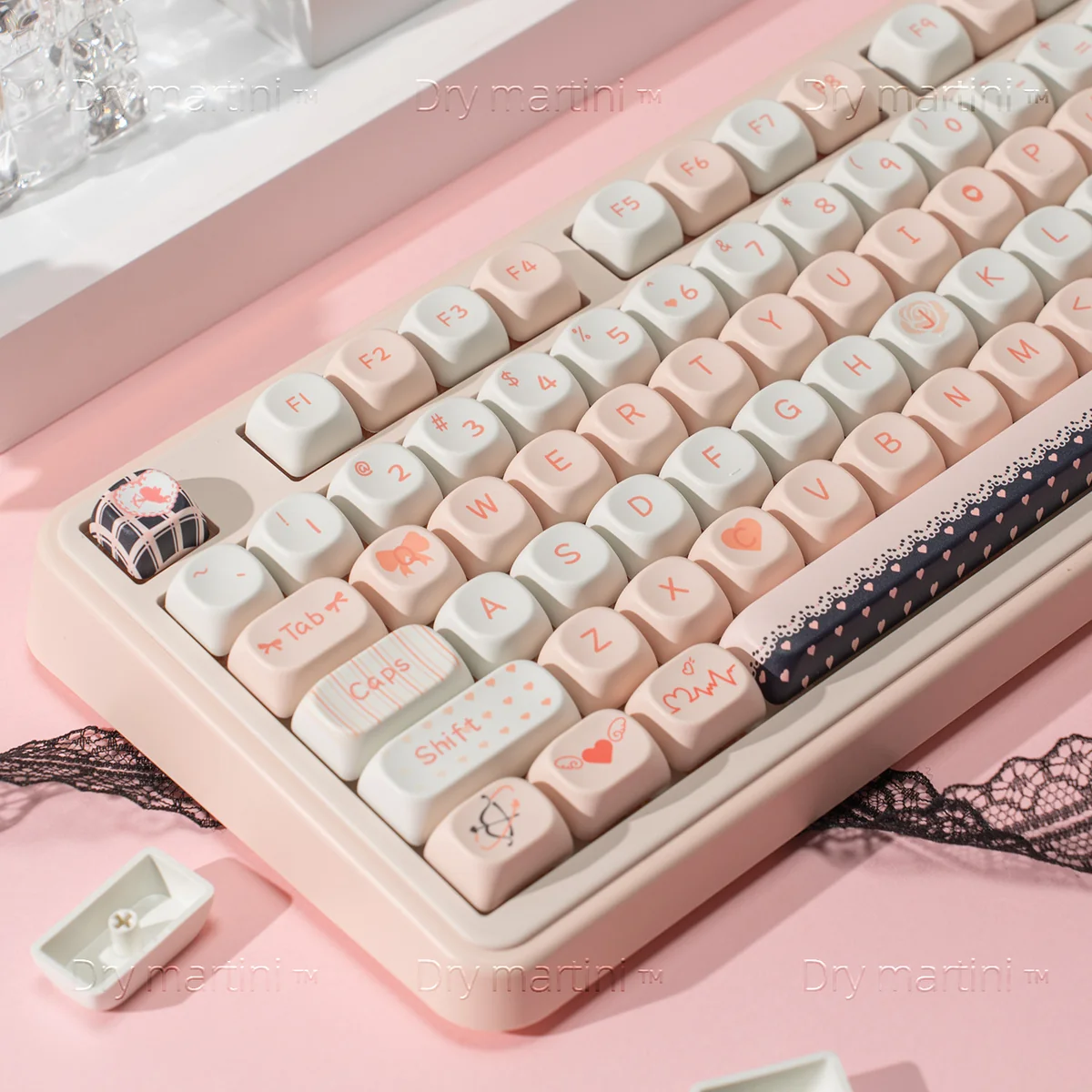 Close-up of Cupid Keycap Set highlighting intricate angelic cherub and heart designs on durable PBT dye-sublimated keys in a dreamy black and pink palette.