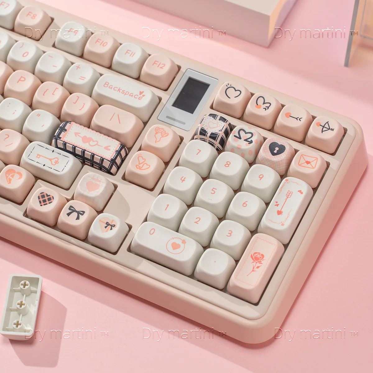 Close-up views of the angelic black and pink Cupid Keycaps PBT dye-sublimation set, highlighting detailed cherubs, hearts, and arrows from different angles.