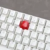 Multiple angled shots of the edgy Danger backlit keycap, highlighting its industrial warning design and striking electric danger illumination.