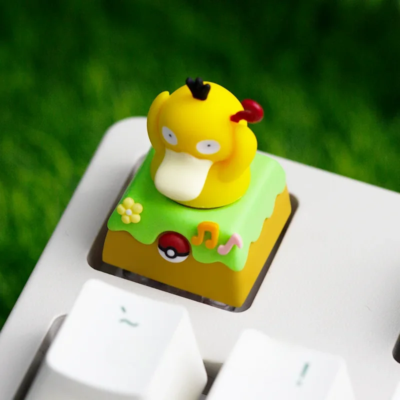 Different angles of the whimsical handcrafted Diglett & Psyduck Keycaps, emphasizing its unique resin artistry and playful rotating design.