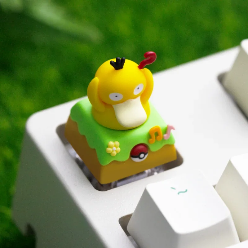 Different angles of the whimsical handcrafted rotating Diglett & Psyduck Keycaps, highlighting its artisan resin details and playful Pokemon design.