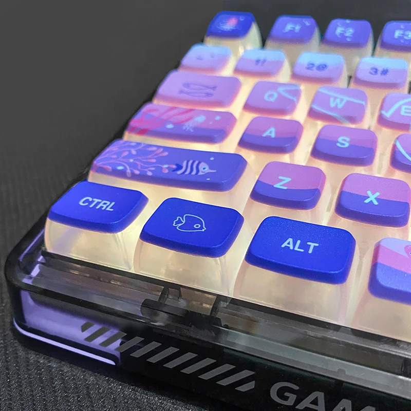 Close-up views of luminous Dreamy Ocean Anime pudding keycaps set, showcasing intricate underwater characters and soft glow from various angles.