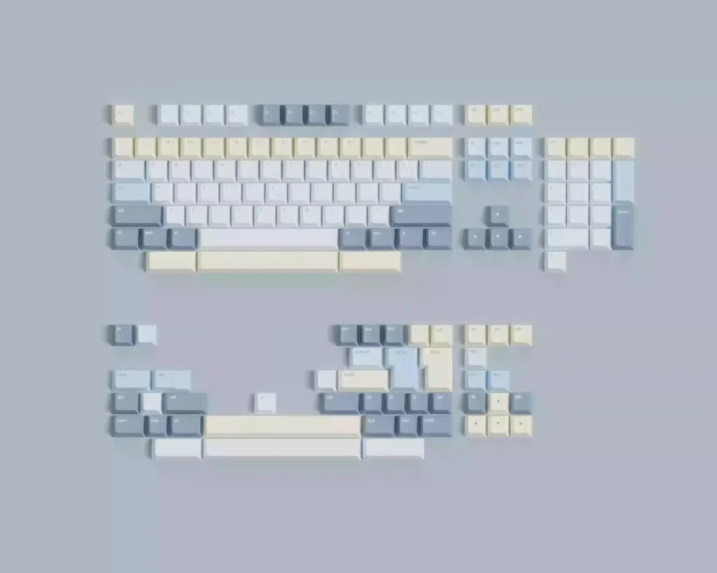 Eternity Moon on Sea magnetic keycaps set shown from various angles. Serene blue and luminous white evoke the ethereal ocean, highlighting magnetic compatibility.