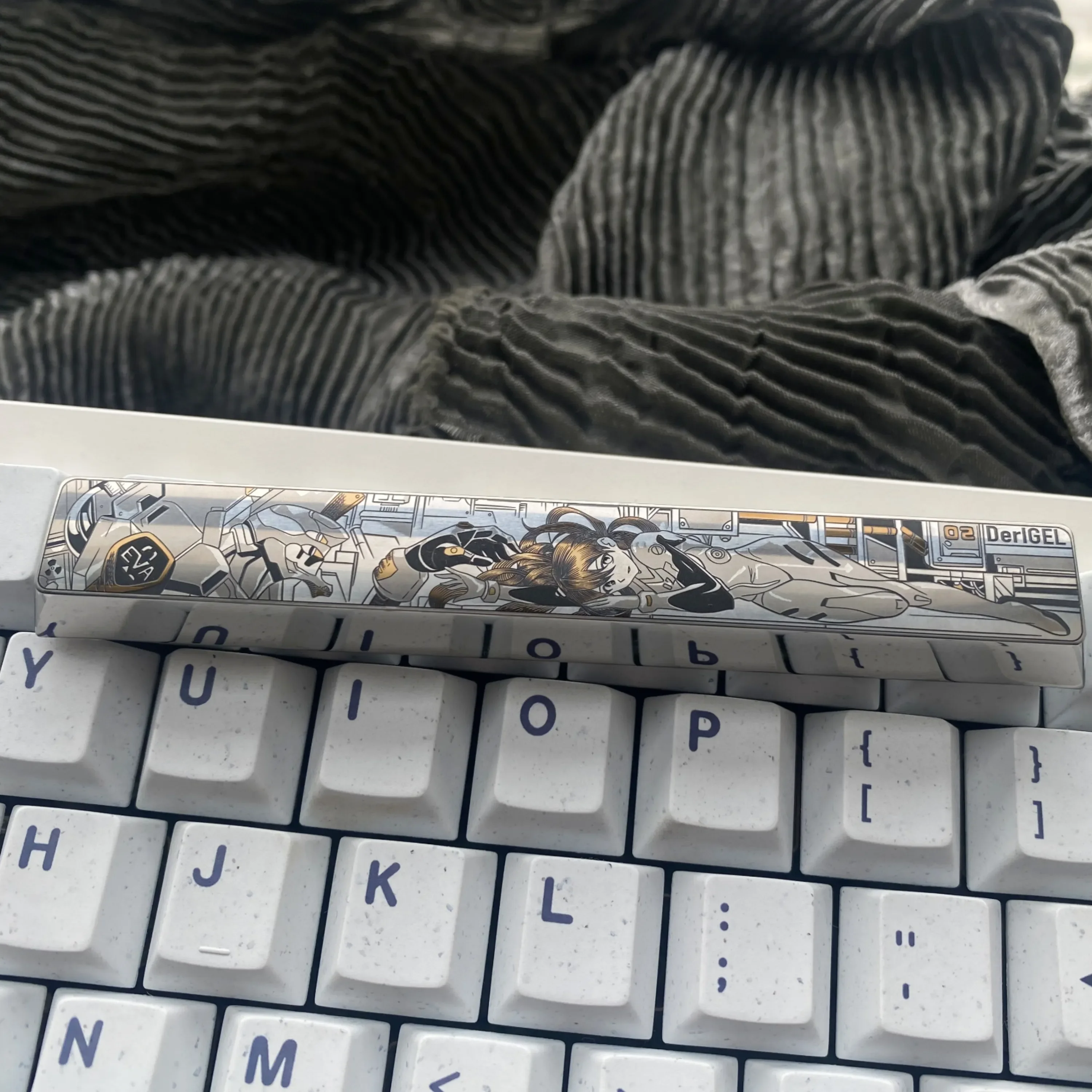 Artistic Evangelion Titanium Keycap featuring precision-engraved Asuka mech design on a colored spacebar, highlighting premium craftsmanship.