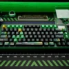 Dynamic gallery view of the exclusive F1 C44 Zhou Guanyu Team Keycap Set, showcasing its premium black and green racing livery from multiple angles.