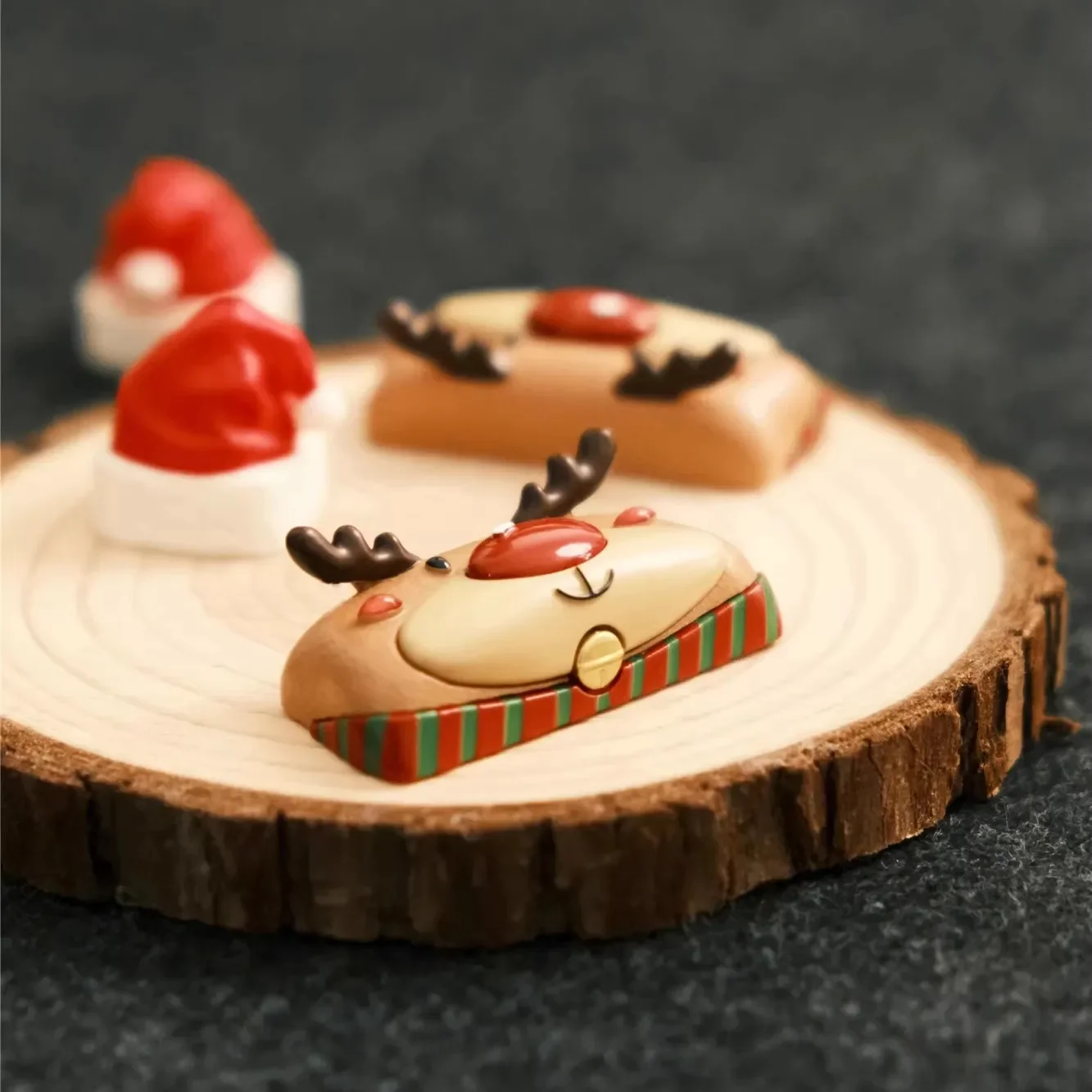 Gallery showcasing the hand-sculpted festive reindeer artisan Christmas keycap from various angles, highlighting its intricate hand-painted details.