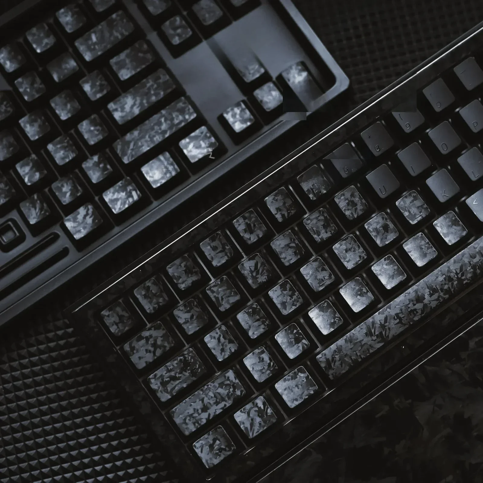 Gallery showcasing authentic Forged Carbon Keycap Set. Matte translucent finish and dynamic texture captivate, exuding dark sophistication.