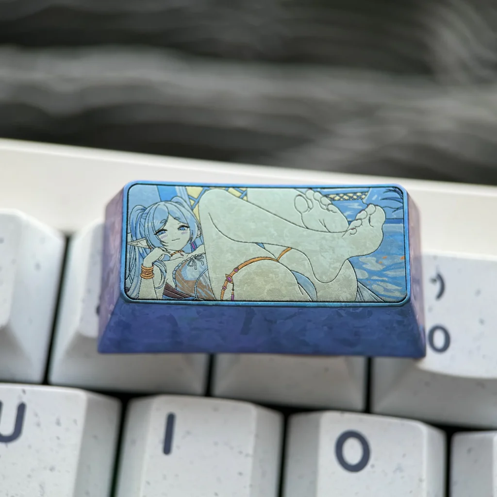 Multiple angles of the handcrafted Frieren Keycap, showcasing its vibrant colorful titanium finish and intricate Elven Mage details.