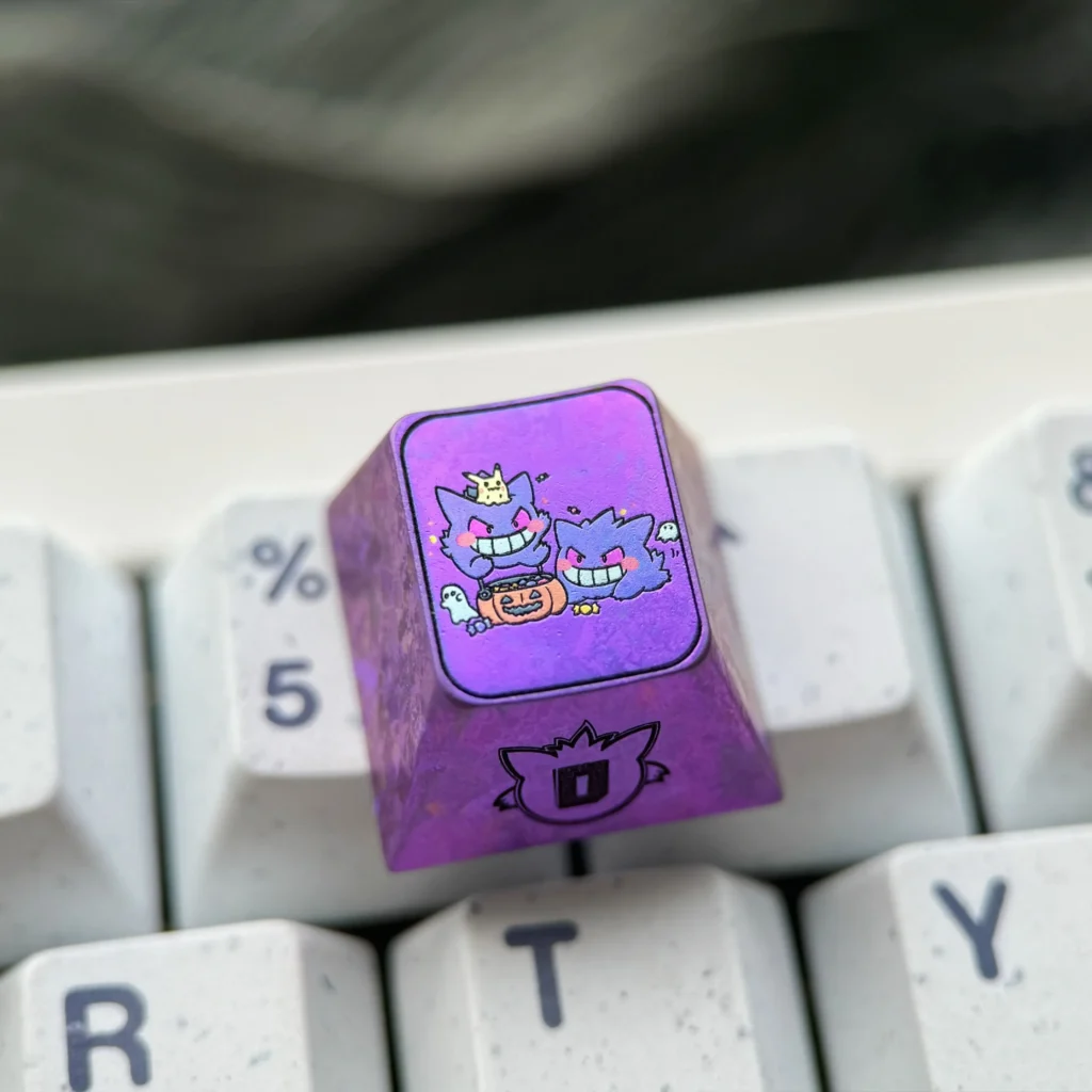 Stunning premium titanium alloy Gengar artisan keycap, custom-crafted with a metallic purple finish, perfect for unique mechanical keyboards.