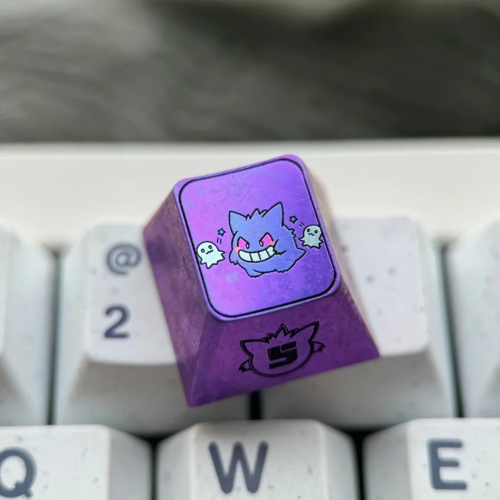 Premium titanium alloy Gengar artisan keycap in metallic purple, perfectly stylized for mechanical keyboards, highlighting artistic craftsmanship.