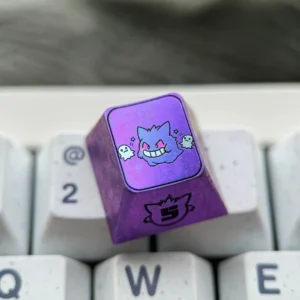 Premium titanium alloy Gengar artisan keycap in metallic purple, perfectly stylized for mechanical keyboards, highlighting artistic craftsmanship.