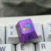 Premium titanium alloy Gengar artisan keycap, showcasing a stylized Gengar with a striking metallic purple finish and artistic design.