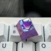 Vibrant Gengar titanium artisan ESC keycap for mechanical keyboards, beautifully crafted from colored titanium alloy with intricate anime details.