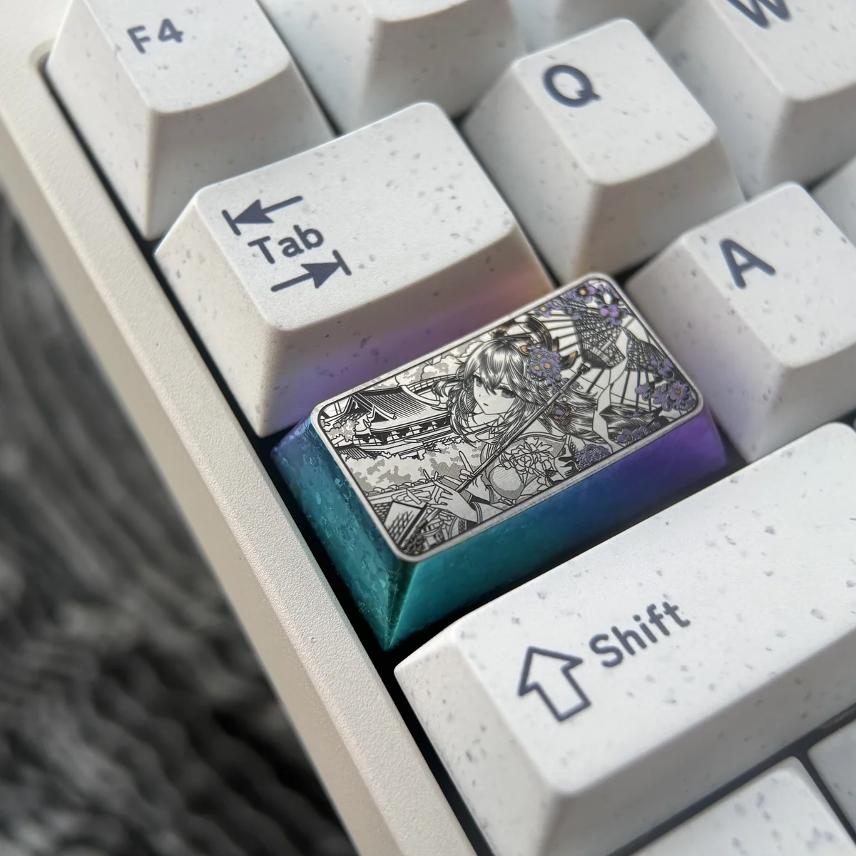 Close-up views of premium Genshin Impact titanium keycaps, featuring engraved Raiden Shogun and Yae Miko anime art from various angles.