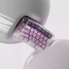 Whimsical Grape Milkshake PBT keycaps set displayed from various angles, highlighting its unique dye-sublimated pastel purple and creamy white beverage design.
