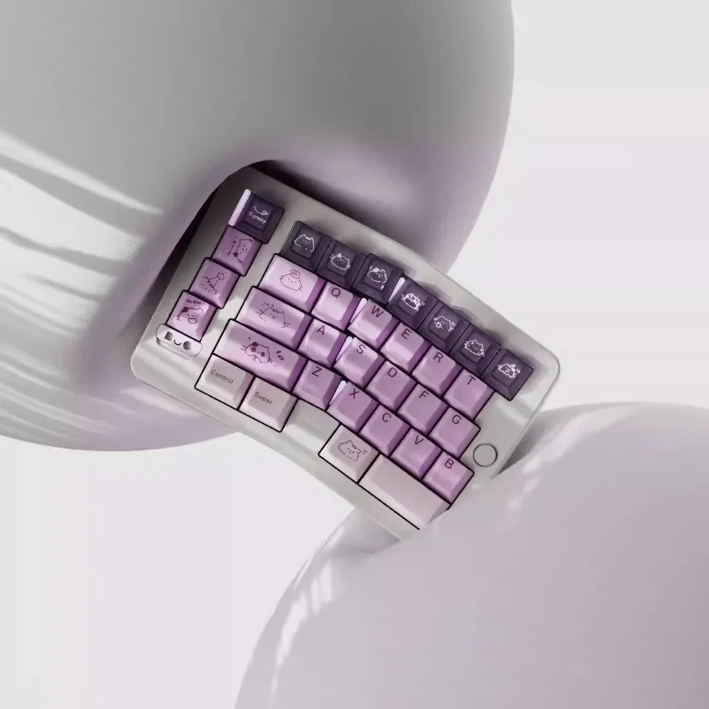 Whimsical Grape Milkshake PBT keycaps set displayed from various angles, highlighting its unique dye-sublimated pastel purple and creamy white beverage design.