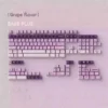 Whimsical Grape Milkshake PBT keycaps set, showcasing the unique dye-sublimated pastel purple and creamy white design from multiple angles.