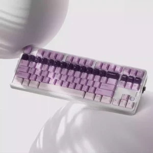 A close-up of the unique Whimsical Grape Milkshake PBT keycaps set, showcasing its sweet pastel purple and creamy white dye-sublimated aesthetic.