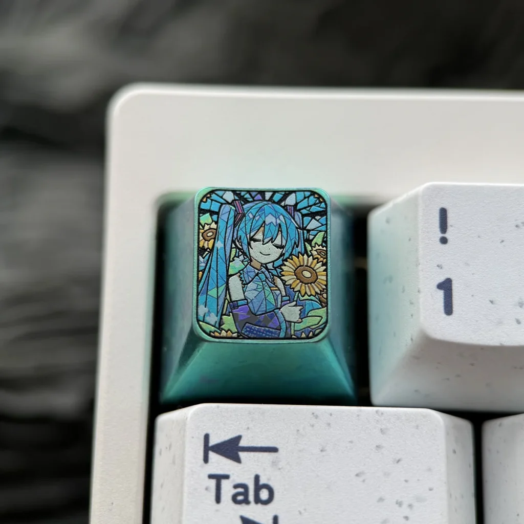 Iconic Hatsune Miku titanium keycap showcasing vibrant anime art, a premium ESC key with sunflower motif and rich green accents.