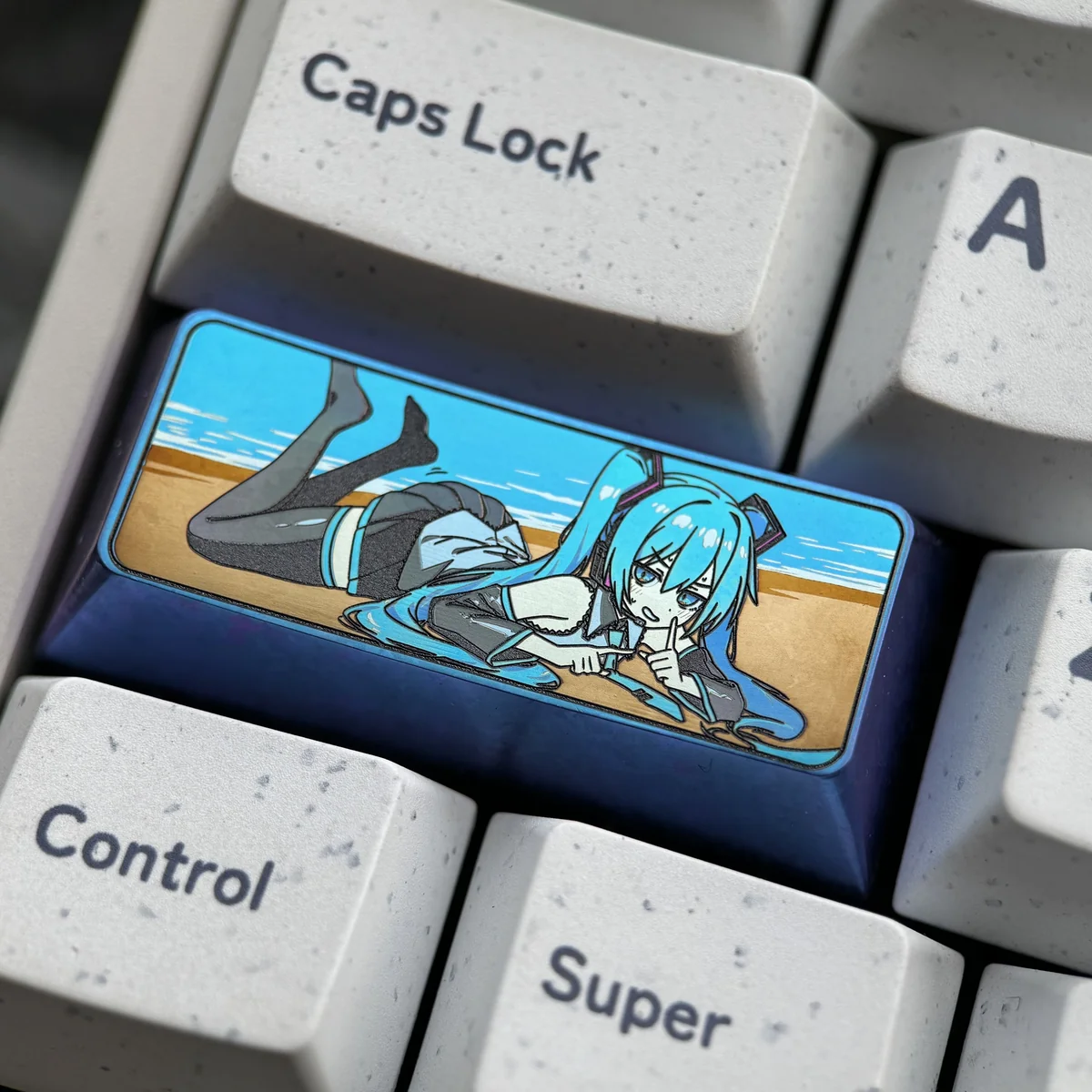 A gallery of the Hatsune Miku titanium artisan keycap, revealing its vibrant cyber-pop design and premium anodized finish from multiple perspectives.