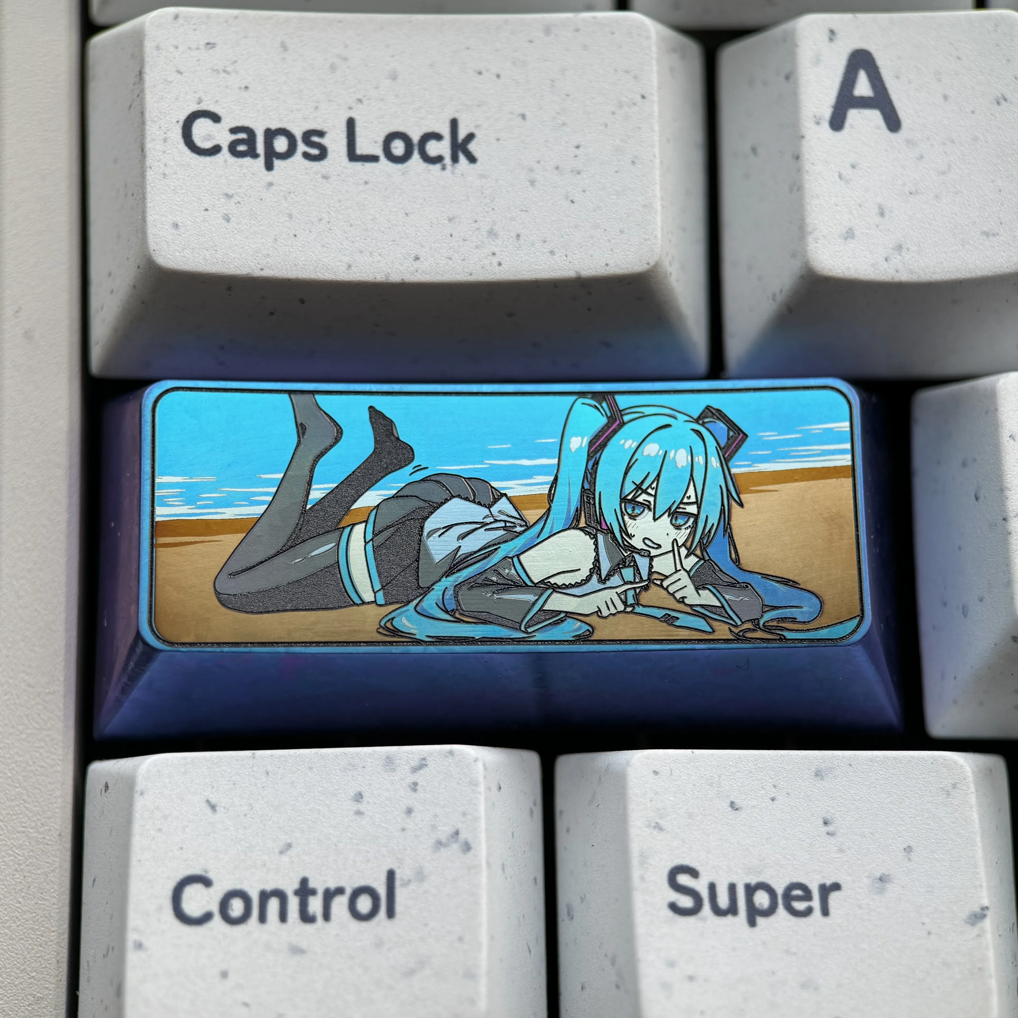 Exclusive Hatsune Miku keycap crafted from vibrant colored titanium. A stunning piece of digital pop artistry for your custom mechanical keyboard.