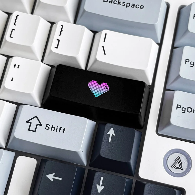Premium black translucent double-shot ABS keycap with a vibrantly backlit red heart icon, enhancing custom mechanical keyboards.