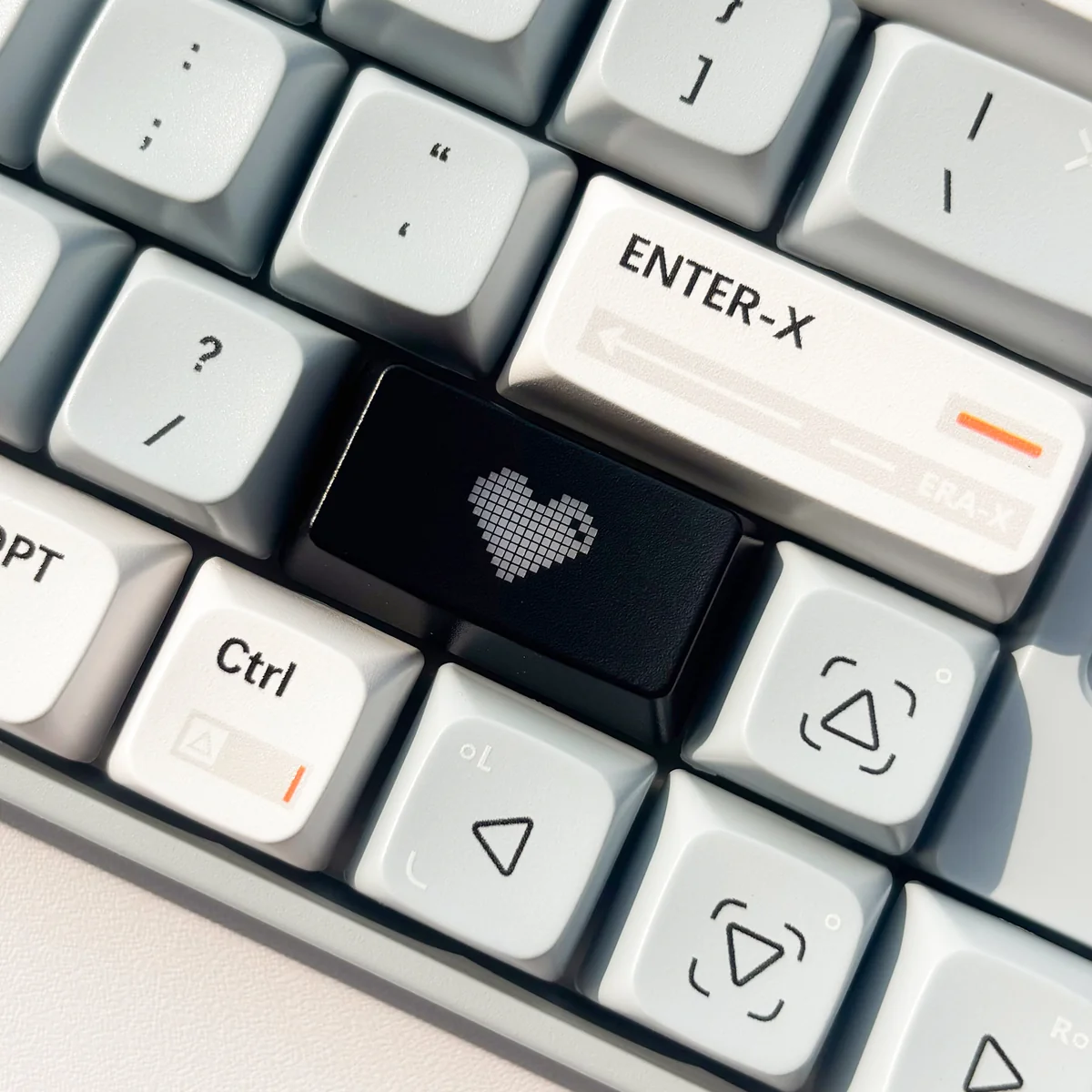 Luminous Heart Shaped Keycap. Various views show its subtle illuminated heart and double-shot design on a dark design.