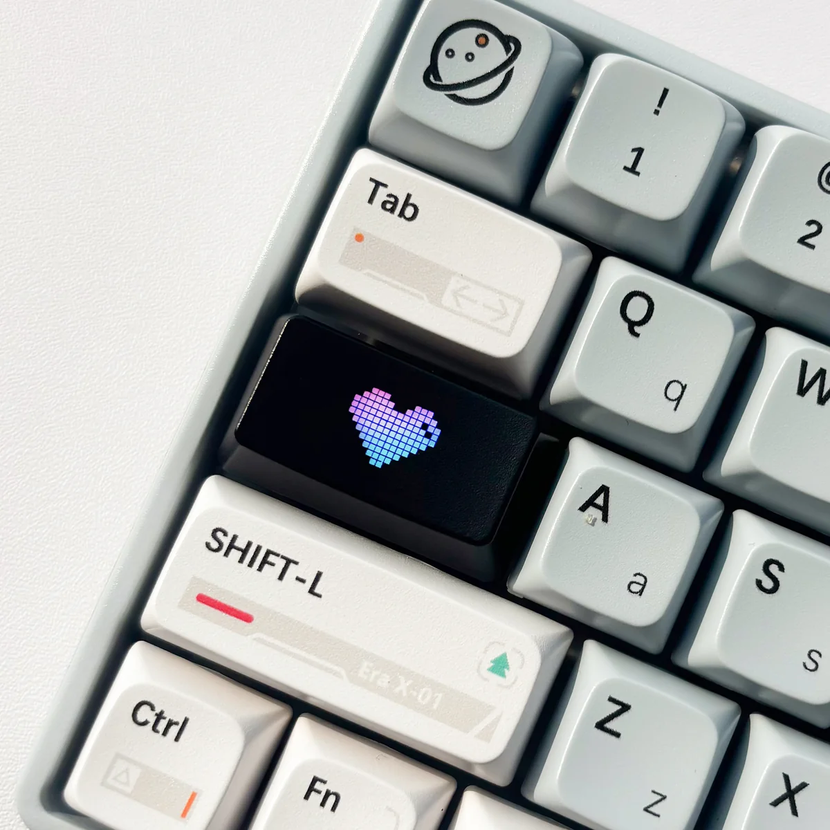 A single Luminous Heart Shaped Keycap, 1.75u, subtly replacing Caps Lock. Features an illuminated heart motif on a sleek, dark design.
