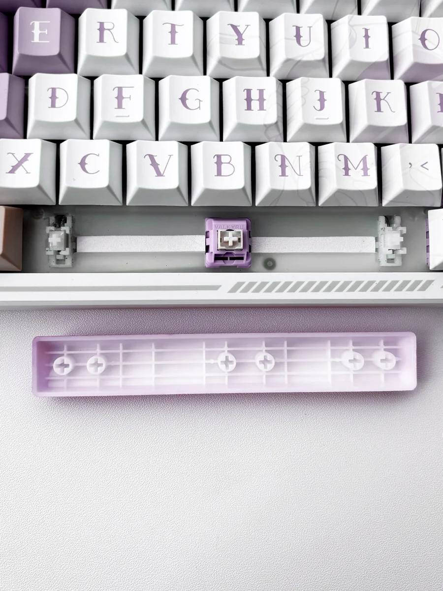 Playful Translucent Heart Space Key Keycap, showcasing its double-shot ABS illuminated heart motif from various angles, a modern keyboard accent.
