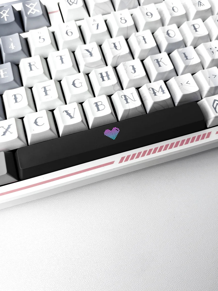 Vibrant Translucent Heart Space Key Keycap, captured from a unique angle, highlighting its playful illuminated double-shot ABS design.