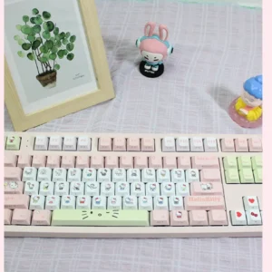 Exclusive Hello Kitty pink PBT keycaps set artfully arranged, showcasing charming character designs perfect for a whimsical keyboard aesthetic.