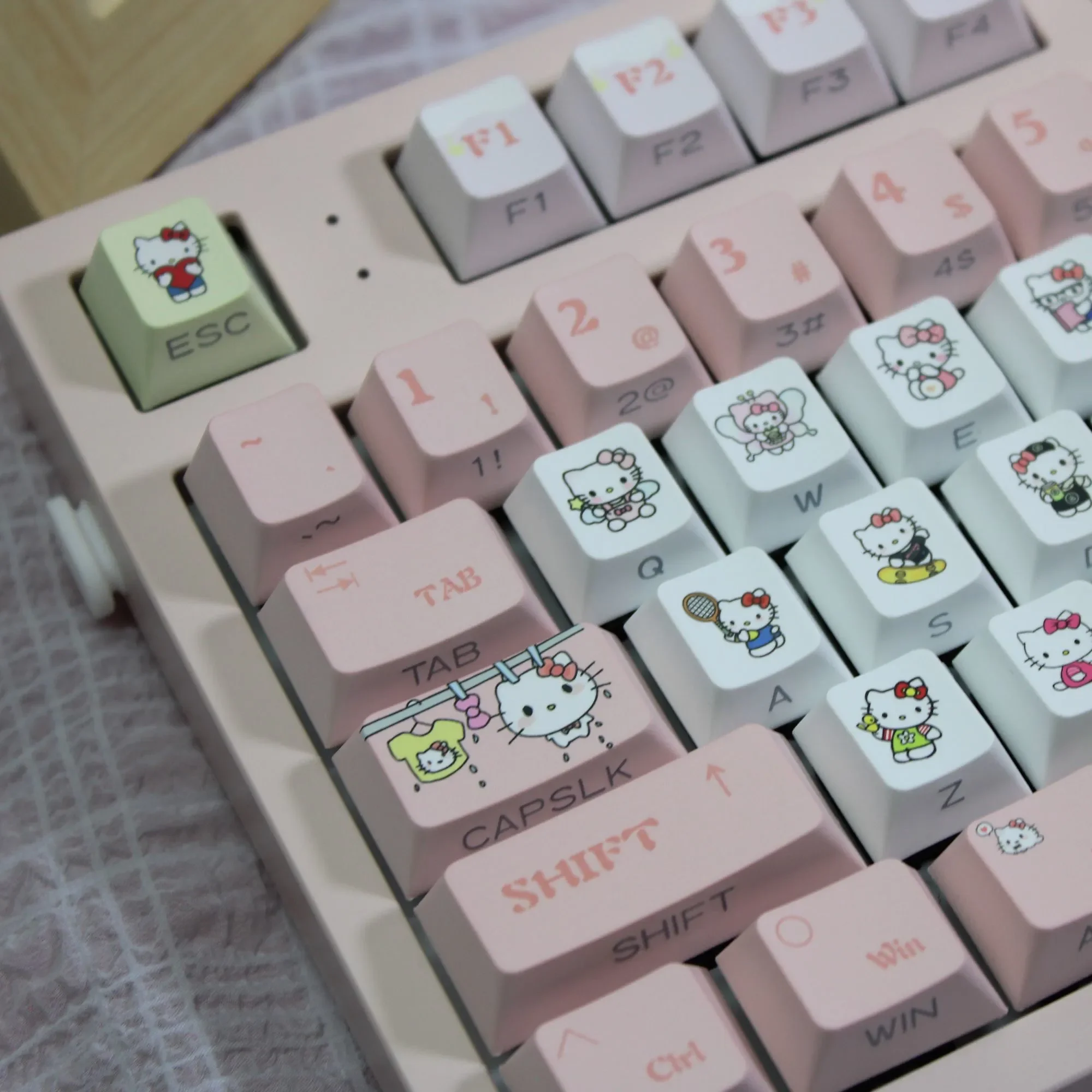 Showcasing the exclusive Hello Kitty Keycaps set in vibrant pink PBT, featuring whimsical spherical keycaps for a charming, playful keyboard.