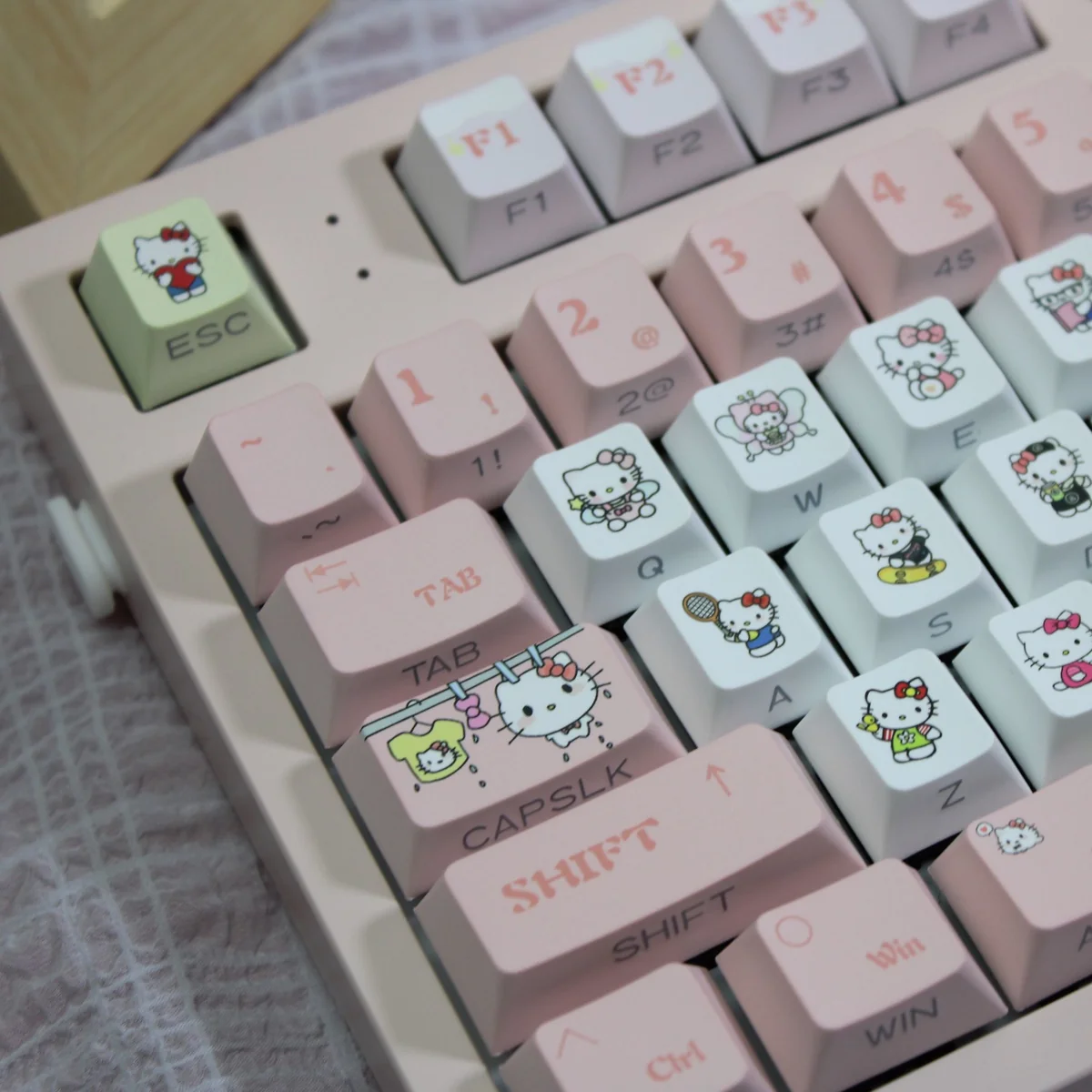 Hello Kitty Joyful Pink PBT keycaps set, an original factory small full set with side translucent legends perfect for vibrant backlighting.
