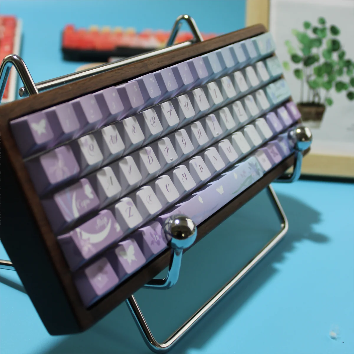 Close-up of the dreamy Iris Butterfly PBT backlit keycap set, showcasing delicate purple irises and ethereal butterflies with serene traditional motifs.