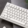Diverse views of the Refreshing Minimalist White Keycap Set, highlighting their serene MDA profile and clean design for peak performance.