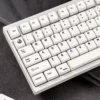 Various views of premium minimalist white magnetic switch keycaps set with serene MDA profile, designed for peak performance and crisp aesthetic.