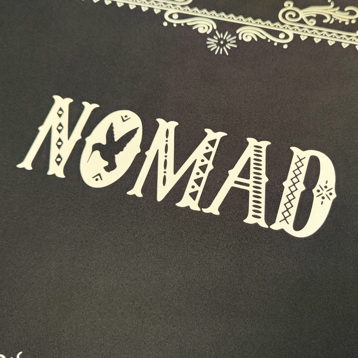 The MEGALOBOX Nomad desk mat boasts iconic gritty anime art, a retro-futuristic design, and a waterproof, anti-slip surface.