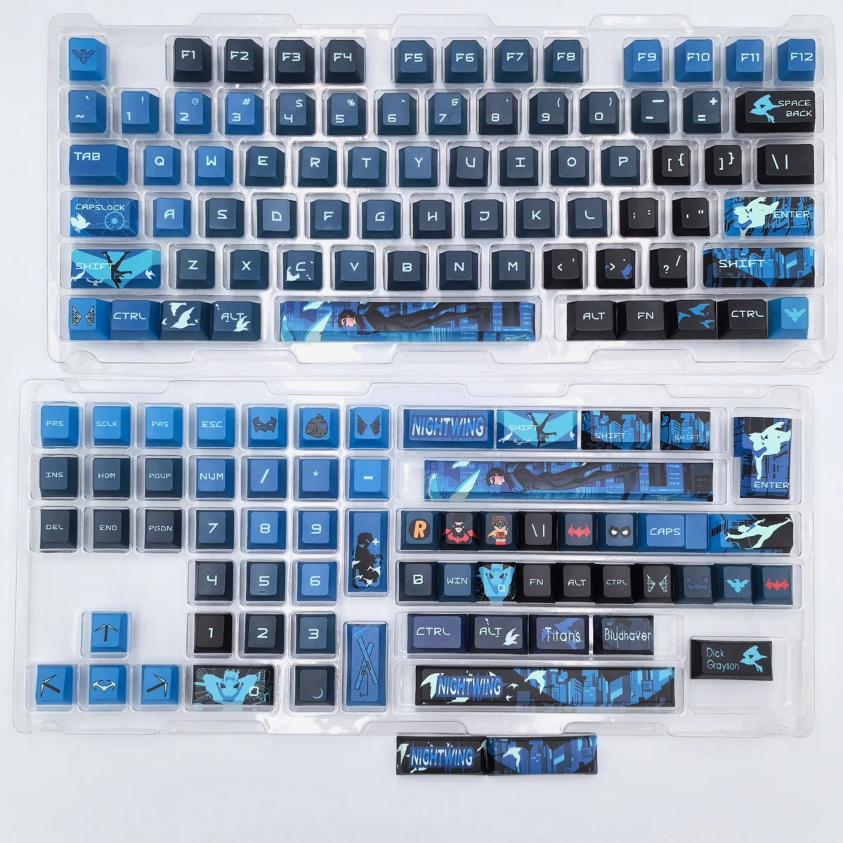 Nightwing Spirit Artisan Keycap Set from multiple angles, highlighting its sleek dark blue and black design and iconic Nightwing emblem.