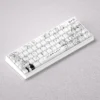 Nishimiya Shoko keycaps set gallery, displaying A Silent Voice artistic PBT dye-sub designs. Multiple angles reveal delicate expressions and iconic