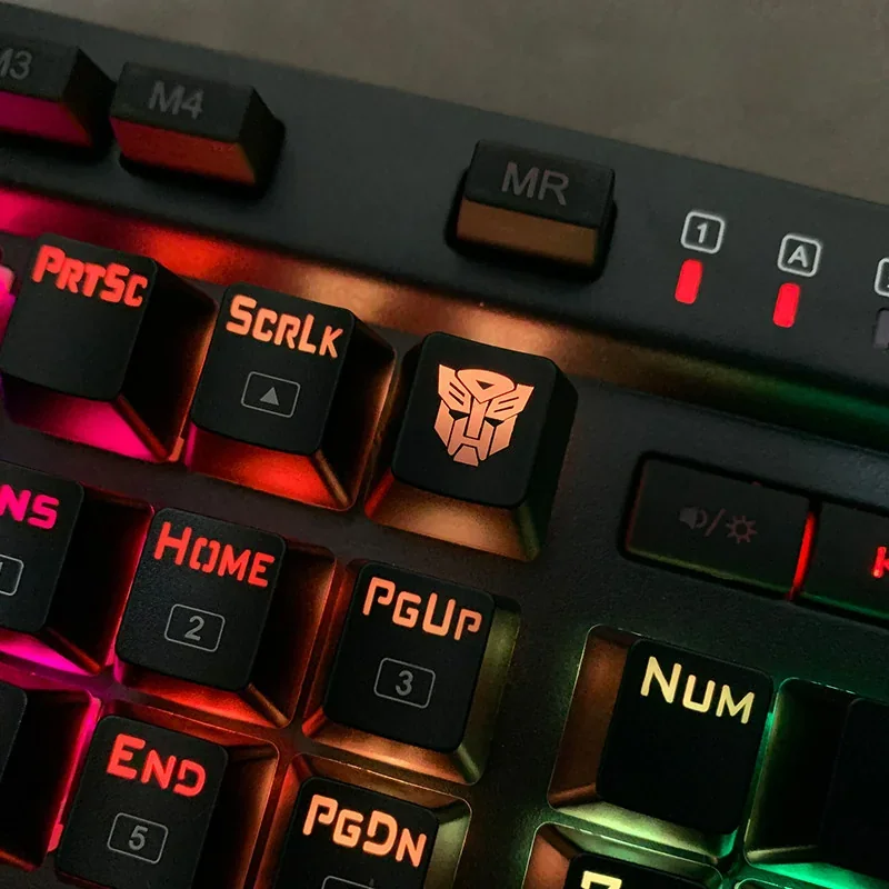 Detailed Optimus Prime mechanical keycap glowing with vibrant backlighting, showcasing its iconic Transformers design from a unique angle, perfect for fans.