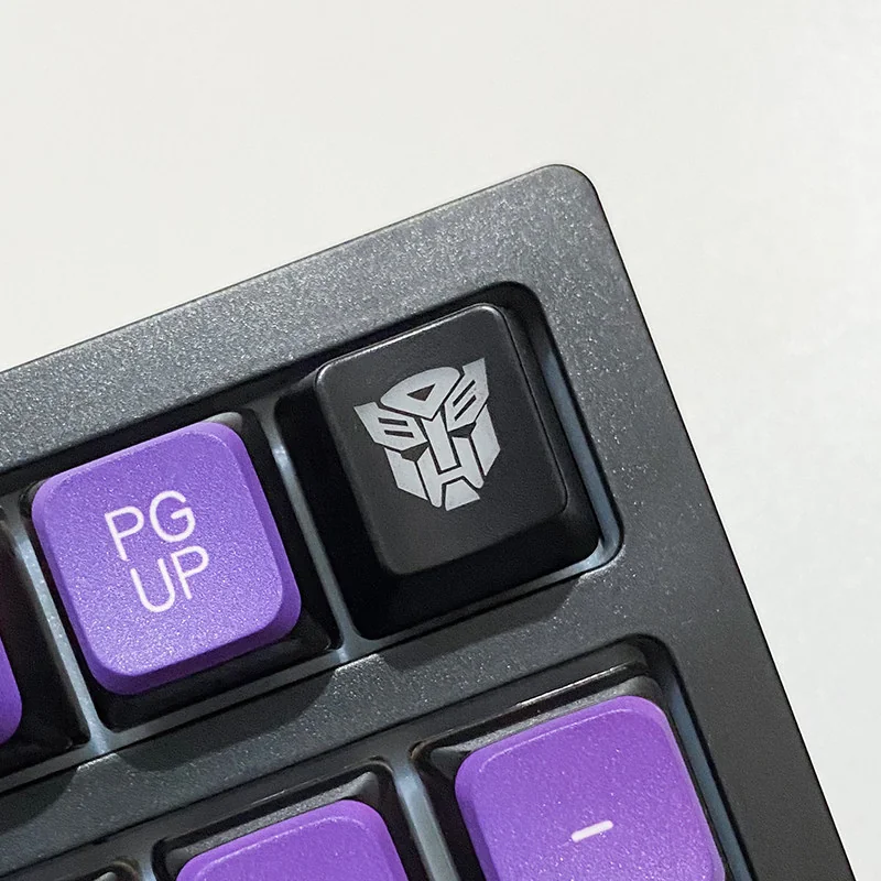 An iconic Optimus Prime backlit mechanical keycap, exquisitely detailed and ready to illuminate your keyboard, capturing the essence of the legendary.