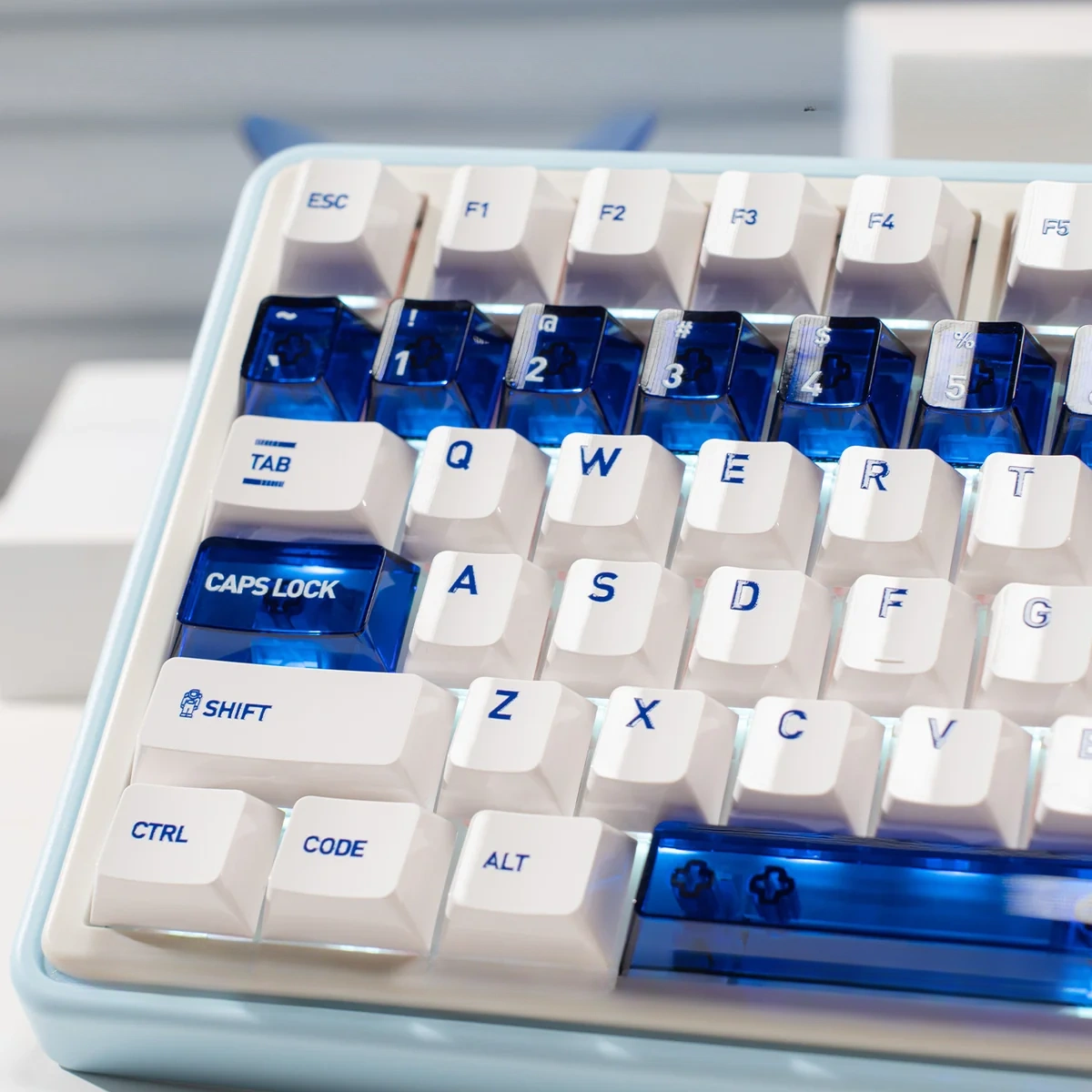 Luminous ceramic-like PC keycaps set in sapphire blue and pure white, displayed from multiple angles to highlight their clean, premium aesthetic.