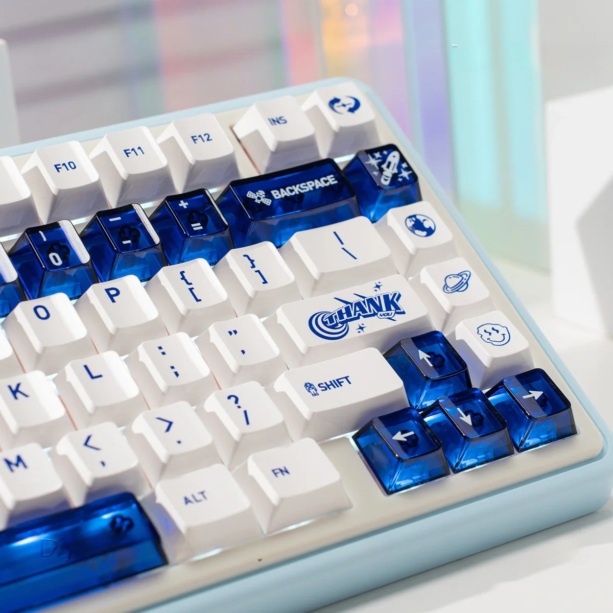 Luminous ceramic-like PC keycaps set in sapphire blue and pure white from various angles, showcasing their premium finish and radiant glow.