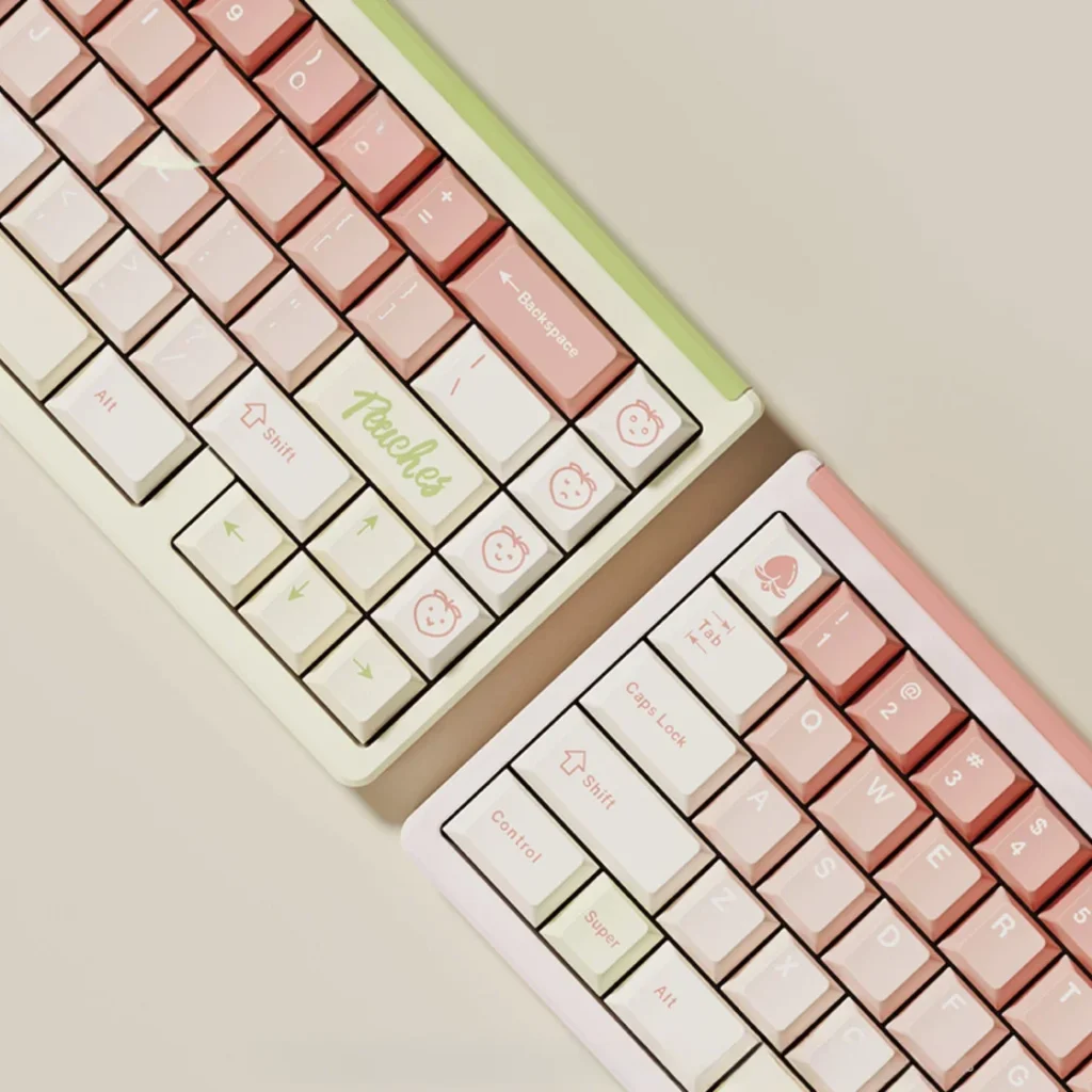 Charming soft peach pink dye-sub PBT keycaps set displayed from multiple cozy angles, highlighting their gentle aesthetic and durable quality.