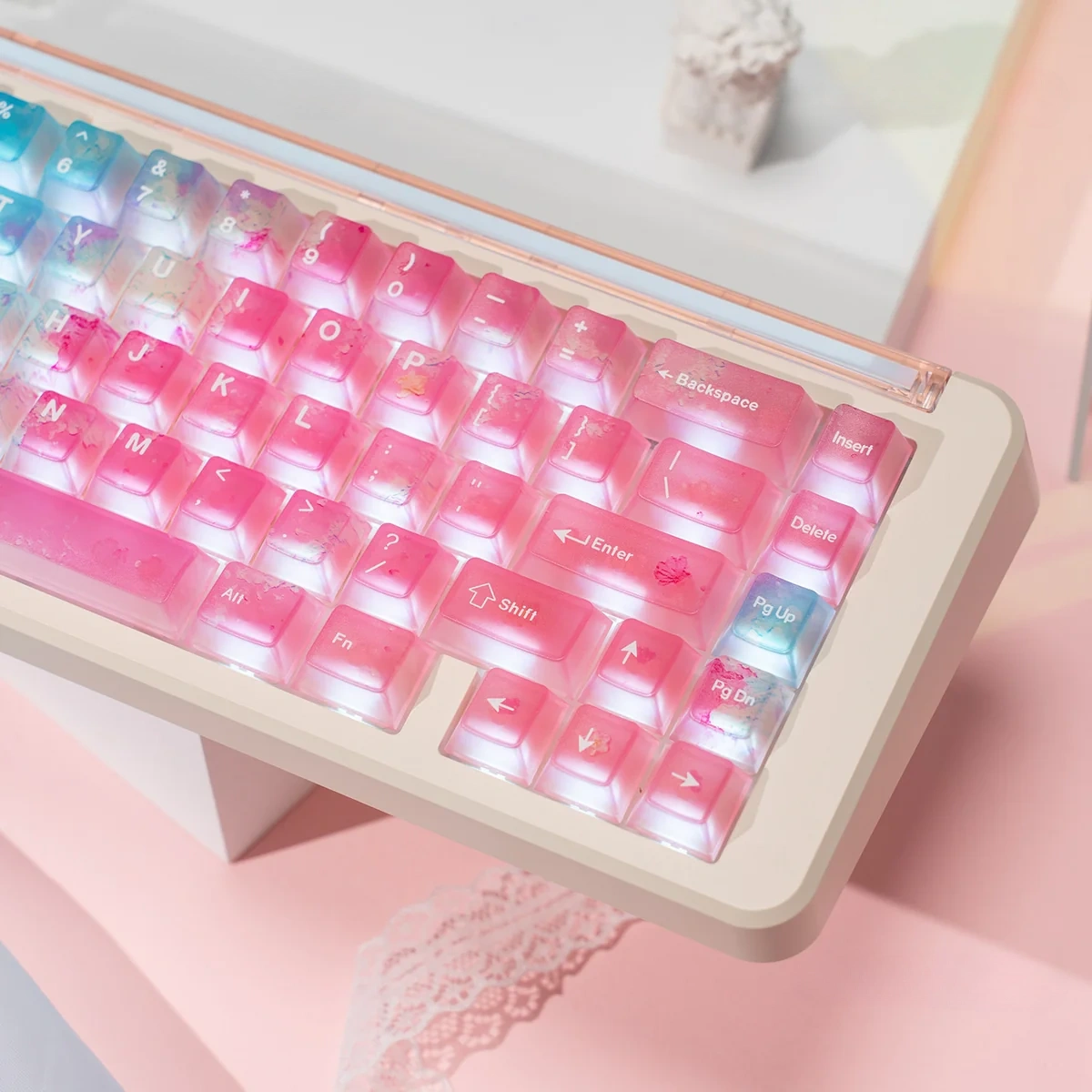 Luminous pink ocean PC keycaps set shown from multiple angles, revealing their ethereal gradient, translucent design, and vibrant RGB light diffusion.