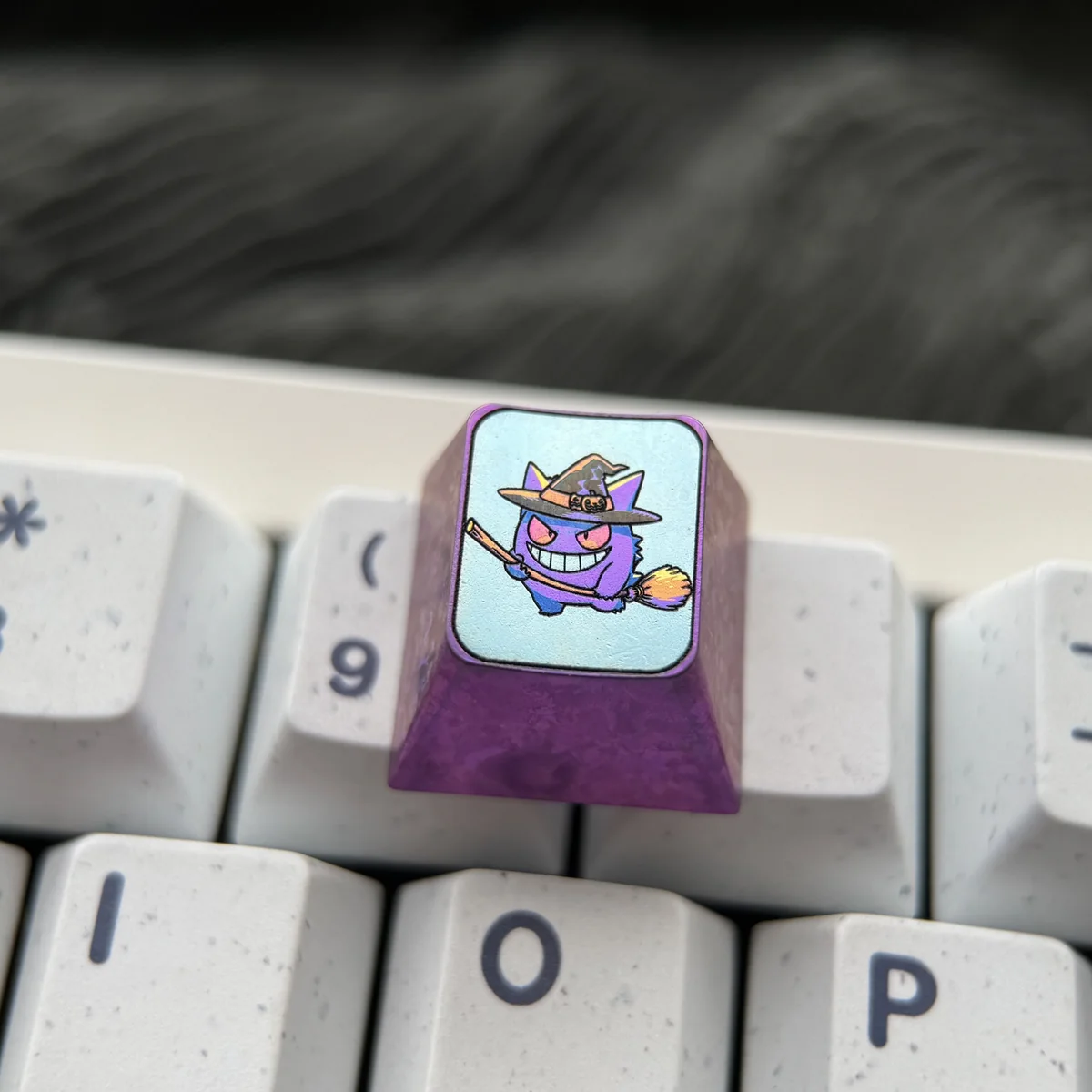 Premium titanium Pokemon Halloween ESC keycap in a detailed gallery view, highlighting its vibrant anime characters and exquisite metallic craftsmanship.