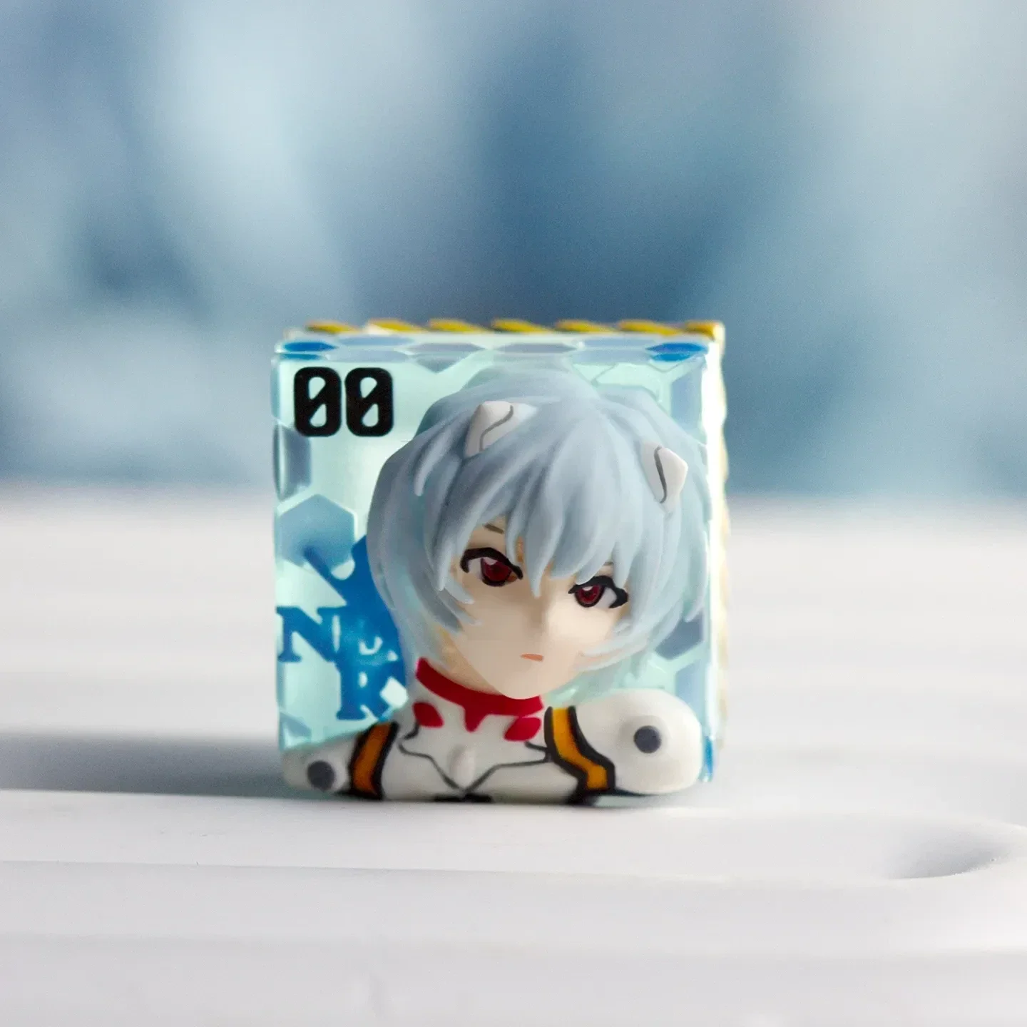 Multiple views of the ethereal Rei Ayanami translucent resin keycap, showcasing its iconic design and subtle backlit glow on a mechanical keyboard.