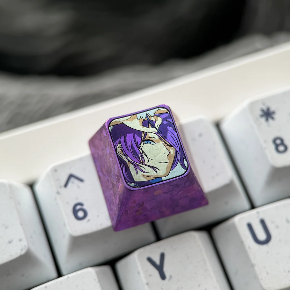 Premium Reze Titanium Keycap with explosive purple ice crystal and detailed Chainsaw Man art on polished titanium, shown from various angles.